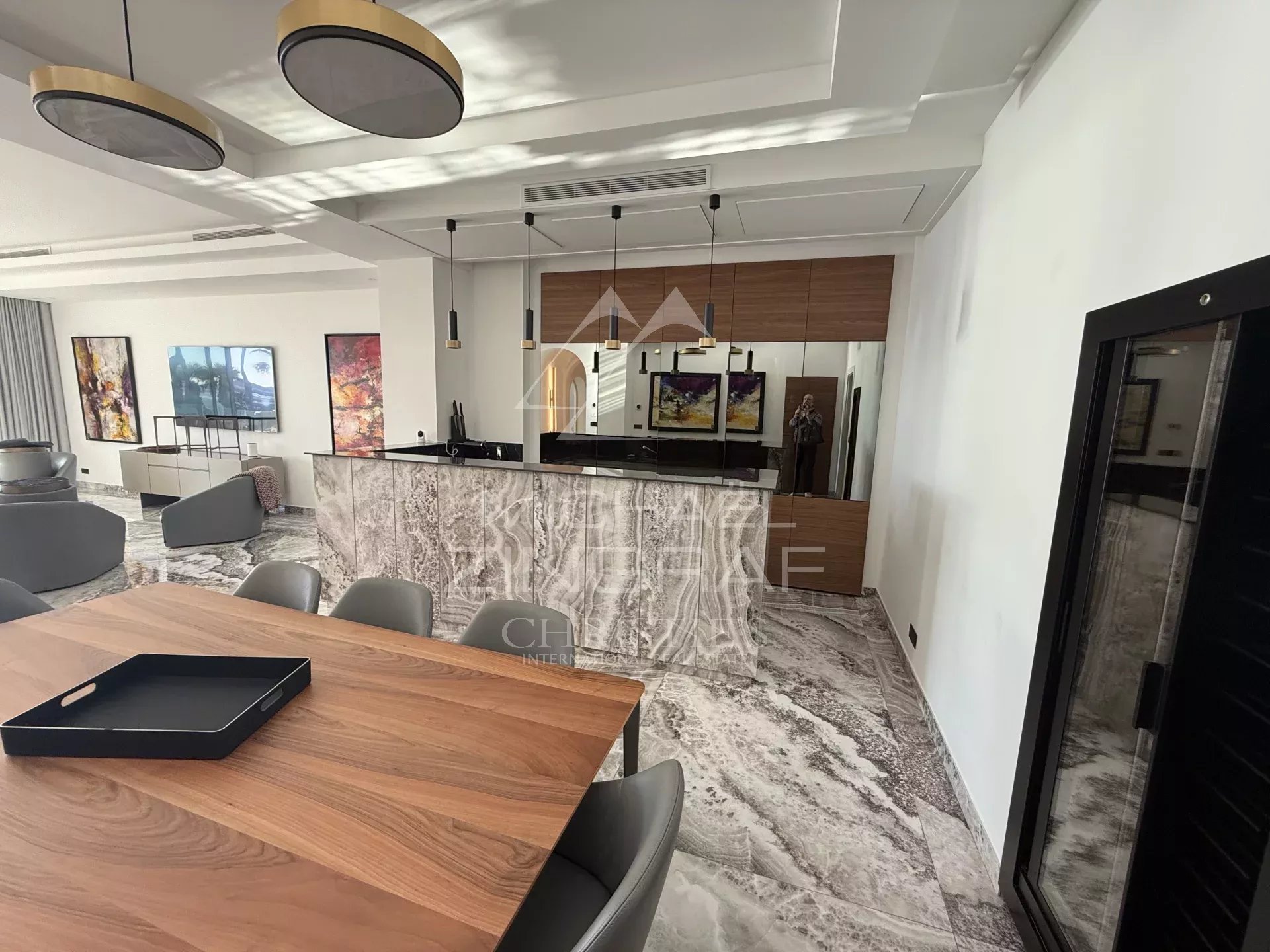 Renovated apartment in Cannes Interior of a renovated apartment in Cannes with open kitchen and dining room.