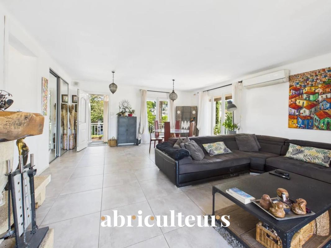 Interior of a spacious family home with a bright living room and access to the outside.