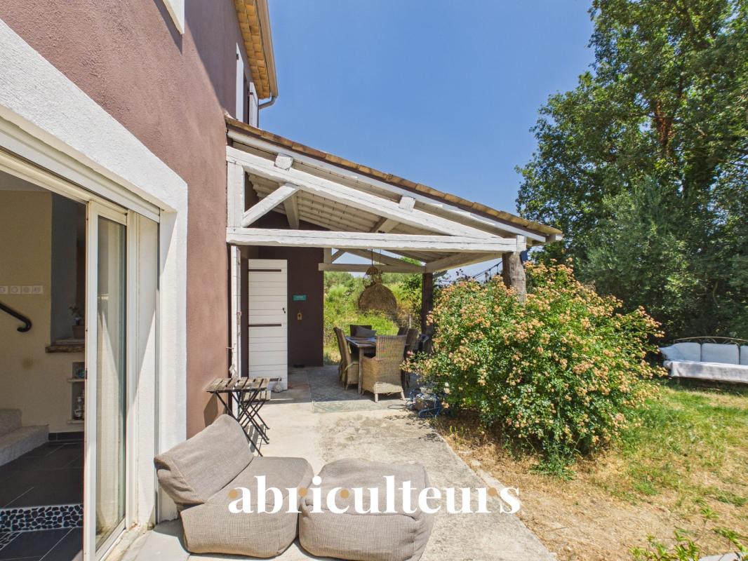 Spacious villa with terrace in Callian Terrace of a villa with outdoor furniture, overlooking a green garden, Callian.
