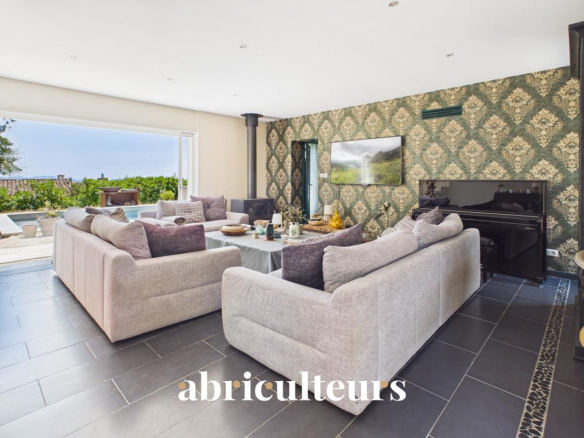 Interior of a spacious villa with a bright and modern living room.