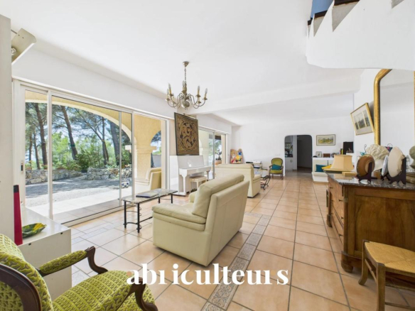 Interior of an architect-designed house with a bright living room and access to the outside.