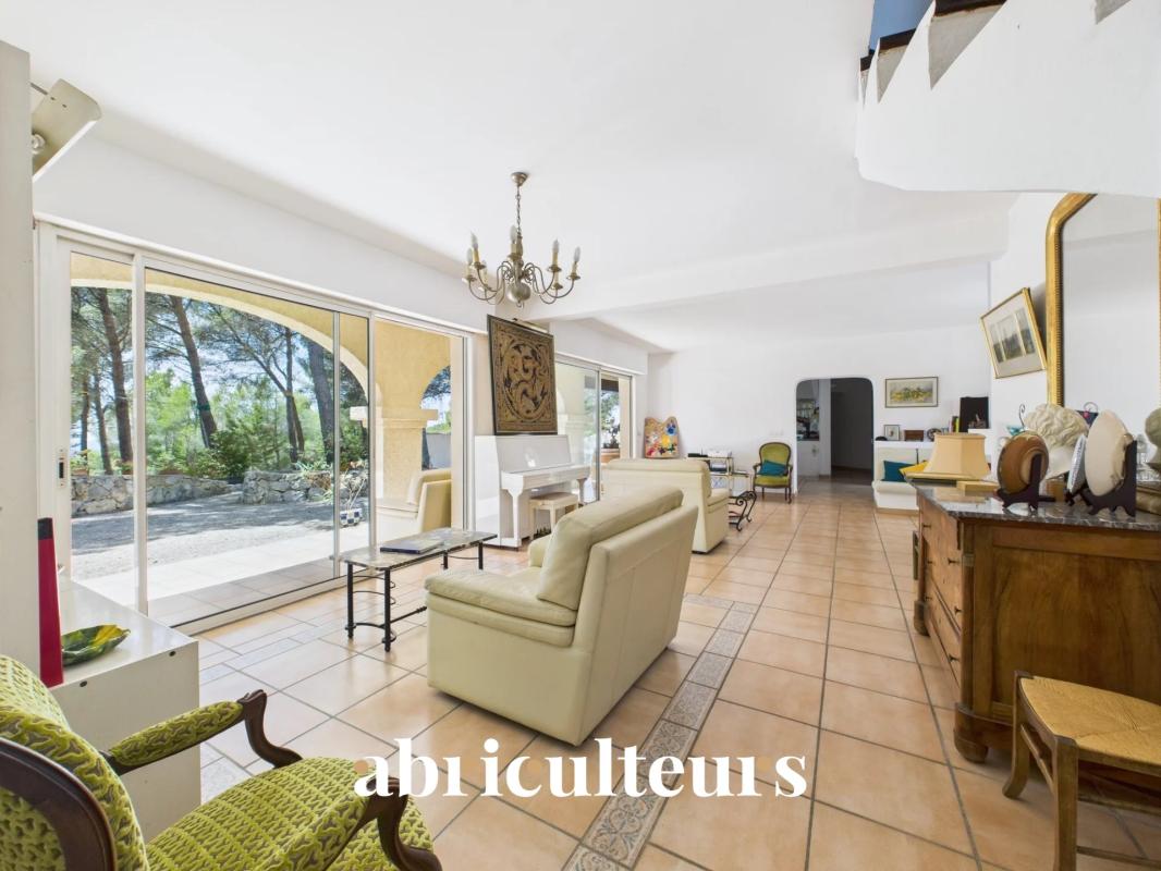 Interior of an architect-designed house with a bright living room and access to the outside.
