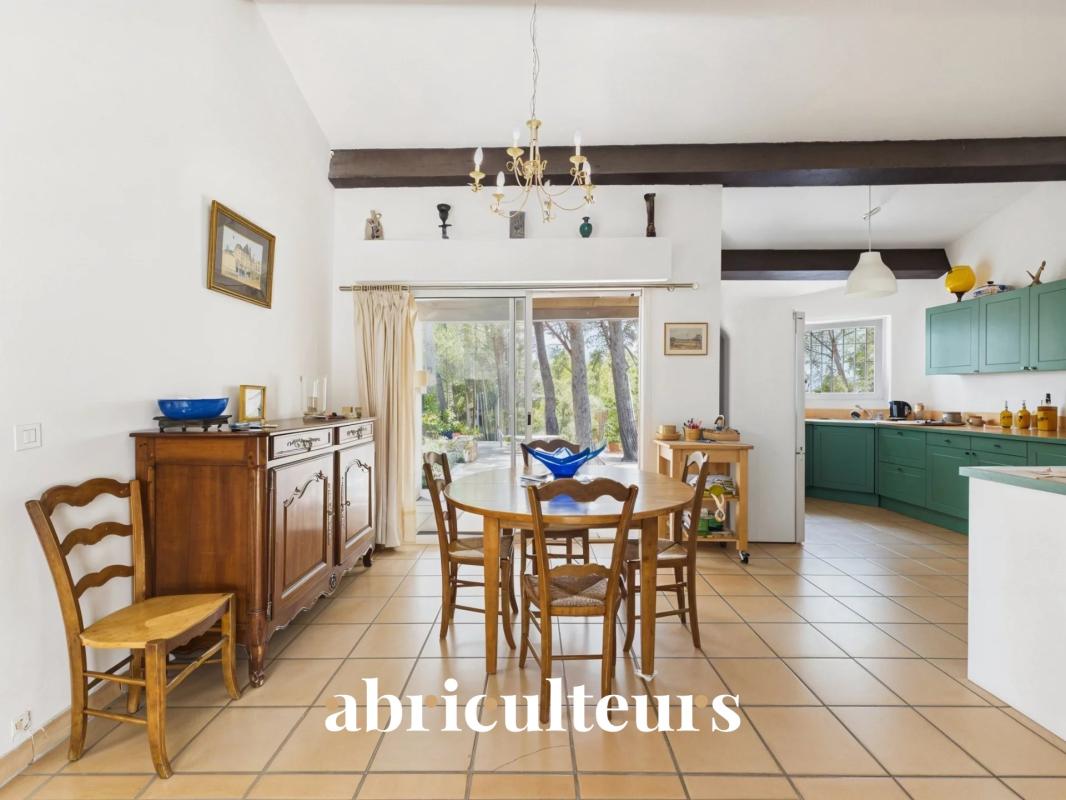 Interior of an architect-designed house with dining room and open kitchen, Ventabren.