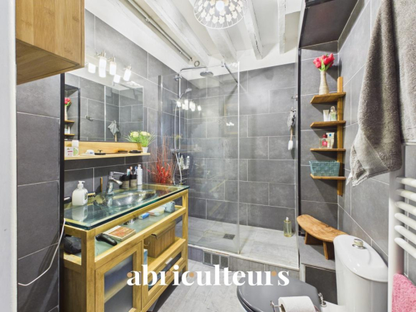 Modern bathroom with walk-in shower and wooden furniture