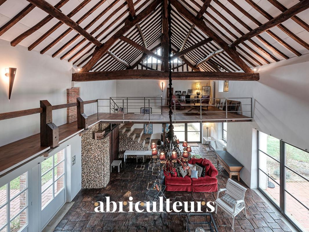 Interior of a 19th-century house in Croisilles Interior of a renovated 19th century house with exposed beams and bright living space.