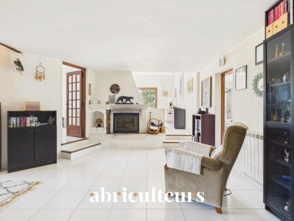 Interior of a spacious house with fireplace and modern furniture in Lambesc.