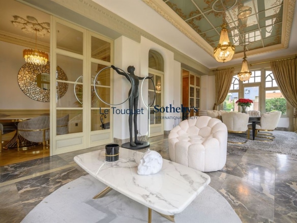 Interior of a 19th century private mansion with an elegant living room and modern furniture.