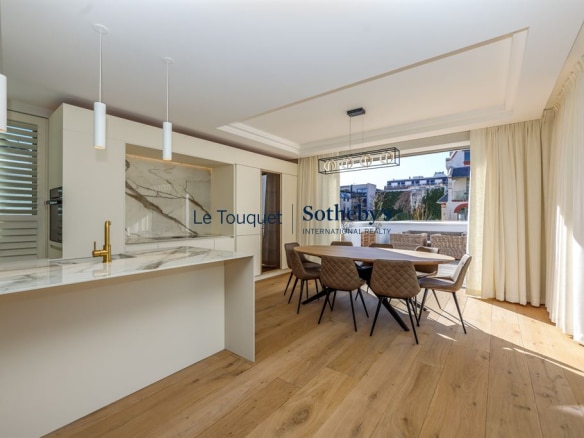 Modern interior of an architect-designed villa with a bright kitchen and dining room.
