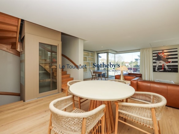 Interior of a contemporary villa with modern living and dining room in Le Touquet-Paris-Plage.
