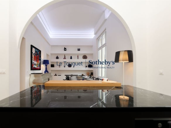 Interior of a contemporary duplex on the ground floor of a former hotel, with high ceilings.