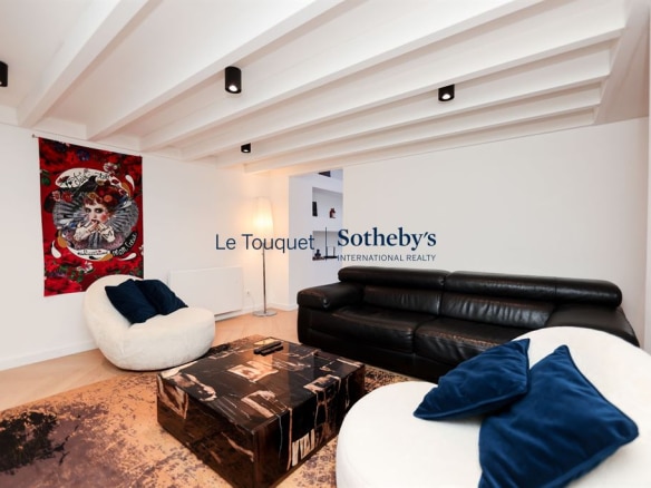 Interior of a contemporary duplex with a modern living room and elegant decorative elements.