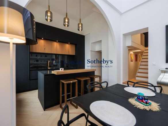 Interior of a contemporary duplex with modern kitchen and dining room in Le Touquet-Paris-Plage.