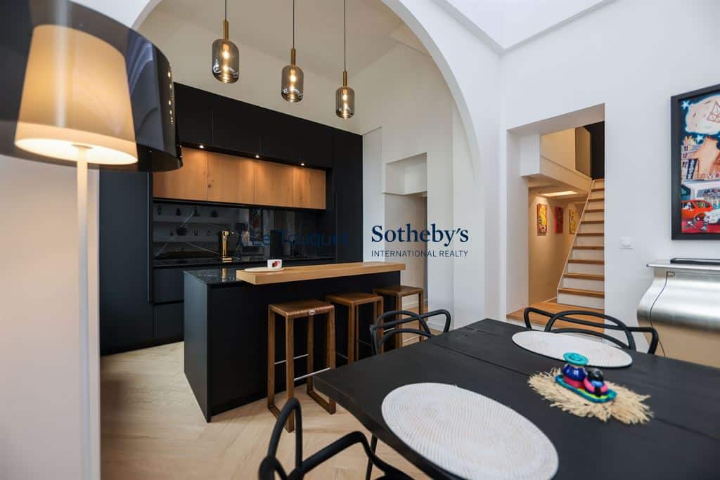 Interior of a contemporary duplex with modern kitchen and dining room in Le Touquet-Paris-Plage.