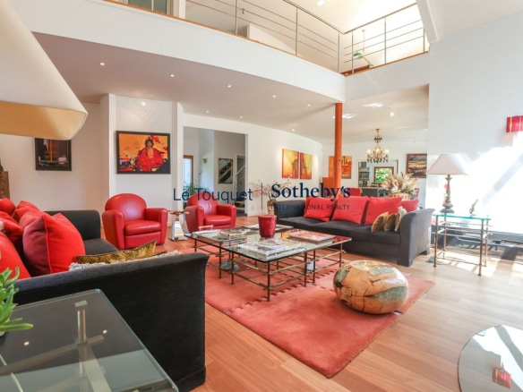 Interior of a contemporary villa with a spacious living room and modern decor in Le Touquet-Paris-Plage.