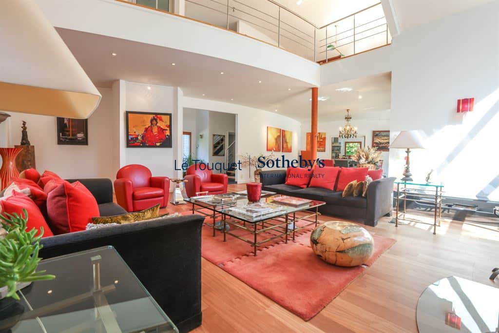 Interior of a contemporary villa with a spacious living room and modern decor in Le Touquet-Paris-Plage.