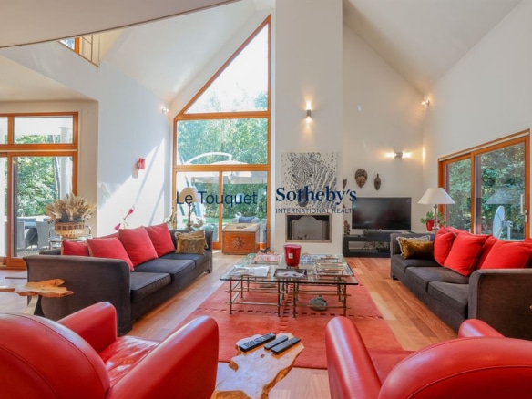 Interior of a contemporary villa with spacious living room and large windows, Le Touquet-Paris-Plage.
