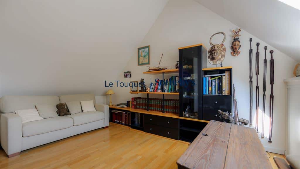 Interior of a family villa with a living room and shelves, Le Touquet-Paris-Plage.