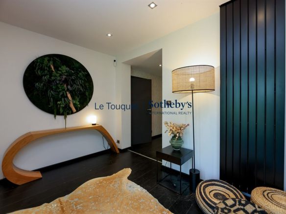Interior of a contemporary villa with modern decor and soft lighting.