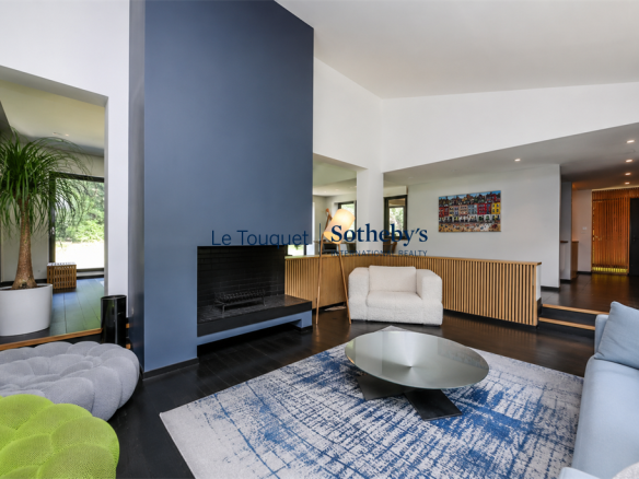 Interior of a contemporary villa with living room and fireplace, modern decor.