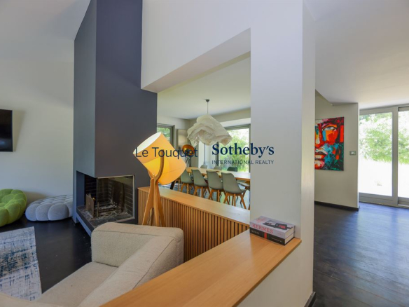 Interior of a contemporary villa with living room, dining room and open kitchen.