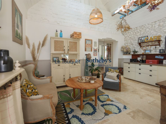 Interior of a renovated property with comfortable furniture and warm decor.