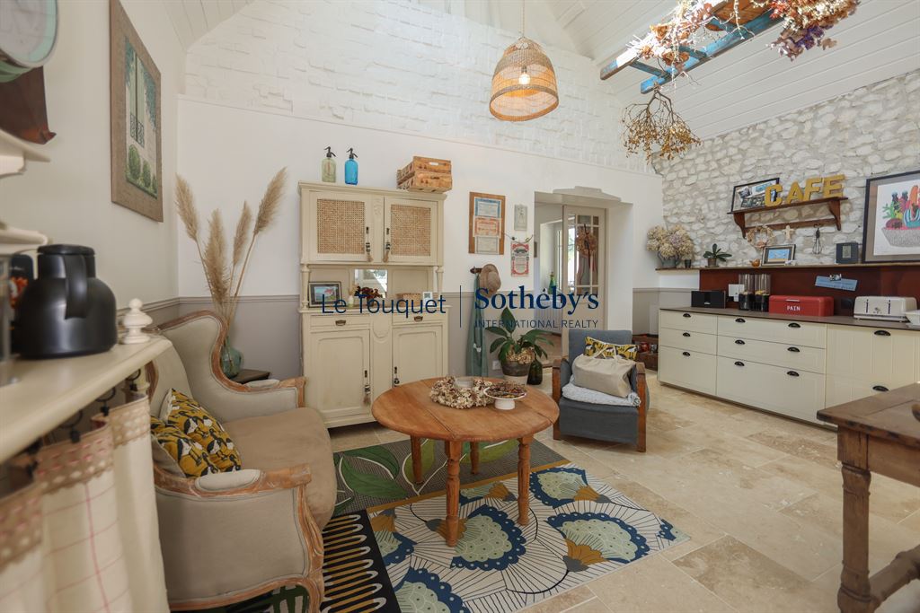 Interior of a renovated property with comfortable furniture and warm decor.