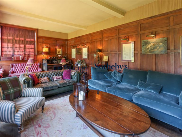 Interior of a historic property with an elegant living room and vintage furniture.