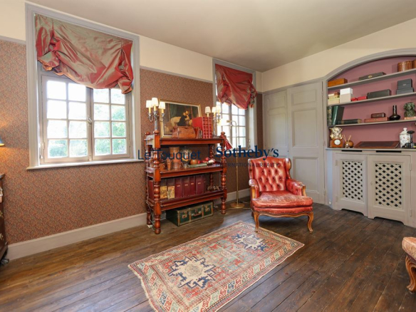 Interior of a historic property with an elegant living room and antique furniture.