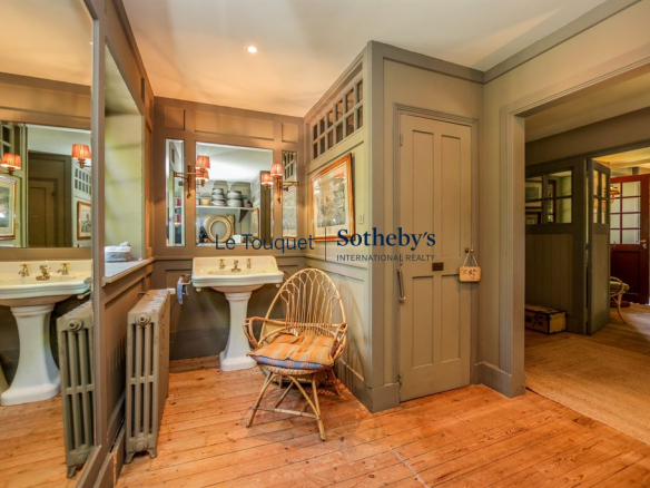 Interior of a historic property with bathroom and living space in Le Touquet-Paris-Plage.