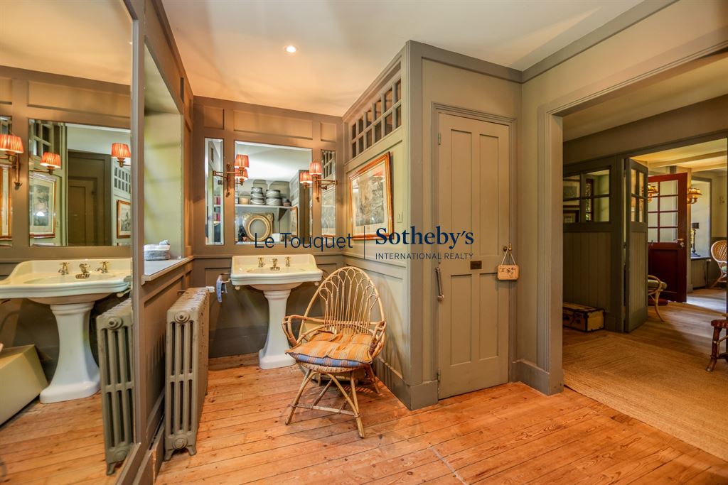 Interior of a historic property with bathroom and living space in Le Touquet-Paris-Plage.