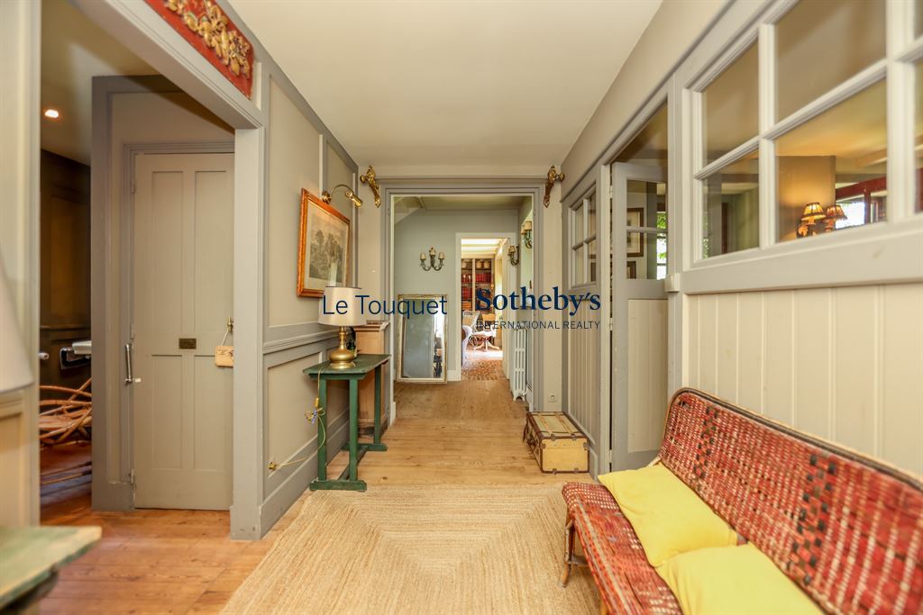 Interior of a historic property in Le Touquet-Paris-Plage with a hallway and a living room.