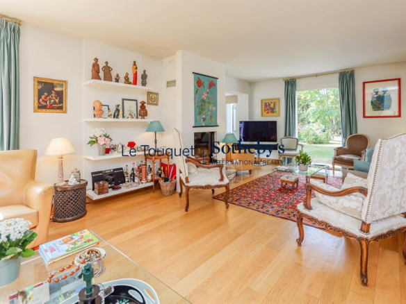 Interior of a bright family villa with living room and elegant decor in Le Touquet-Paris-Plage.